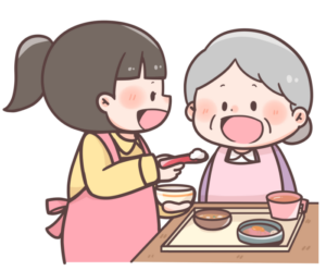 高齢者の食事介助をする女性